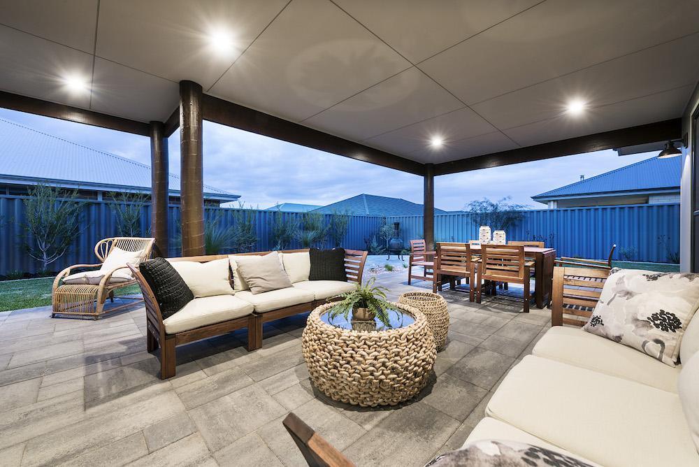brightly lit alfresco area with living/dining section