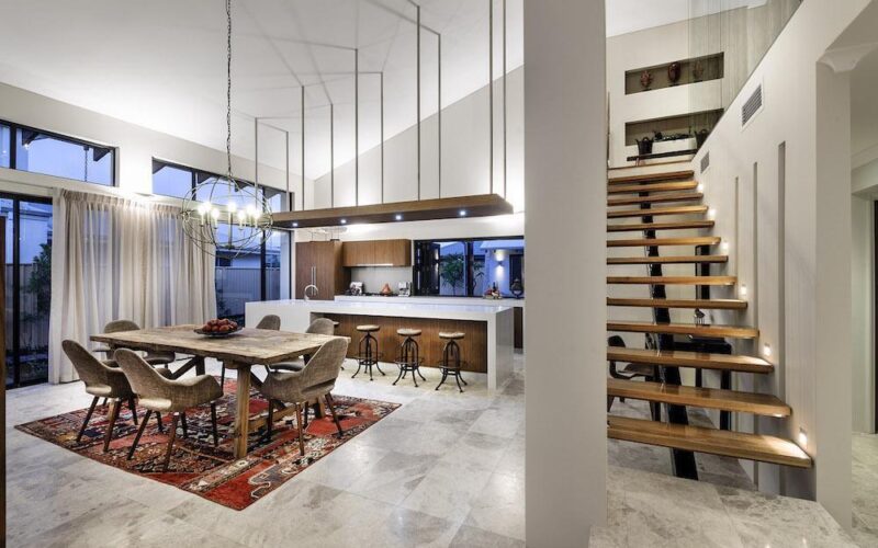 internal shot of home design with raised ceilings and open timber staircase