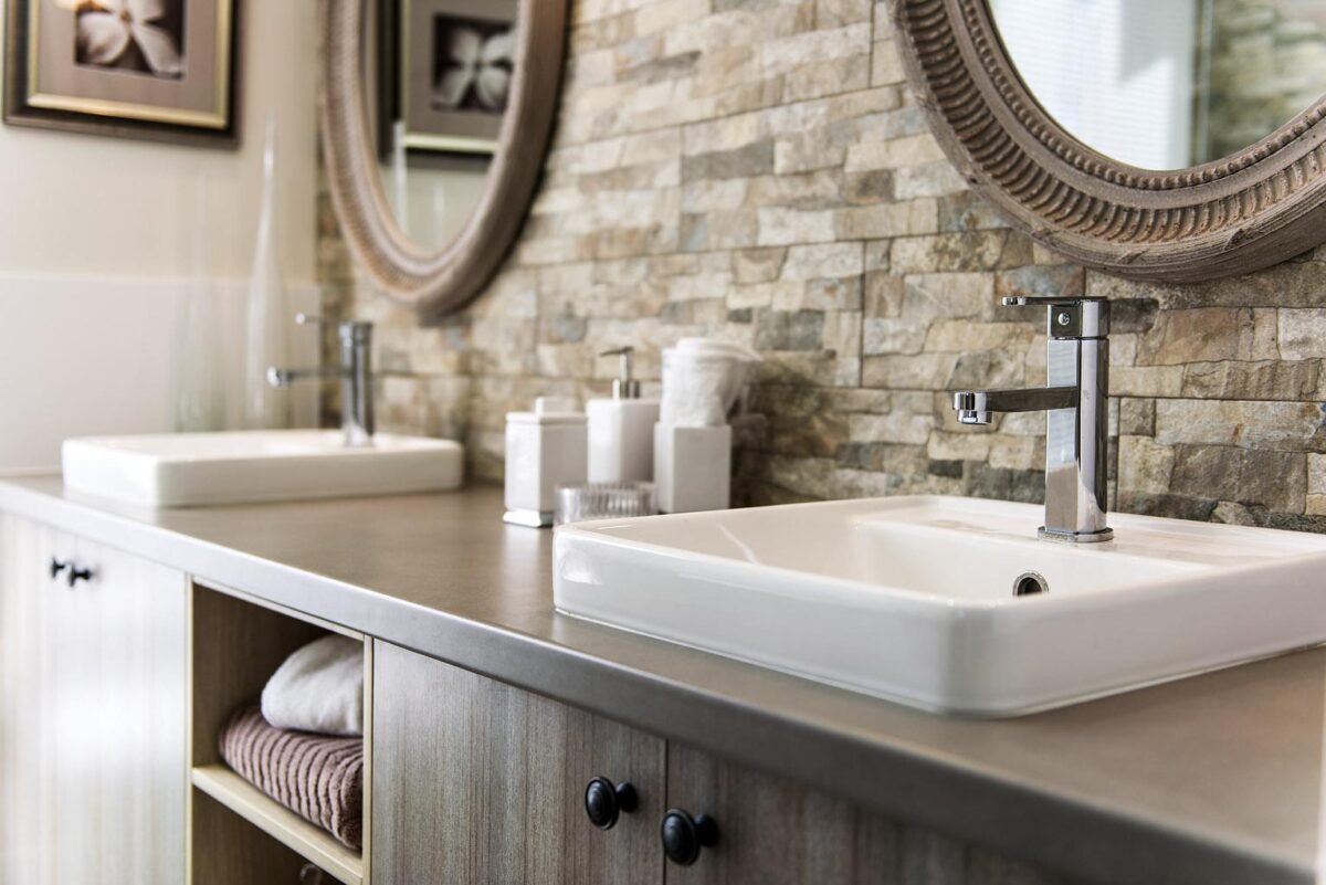 bathroom sink with stone splash back