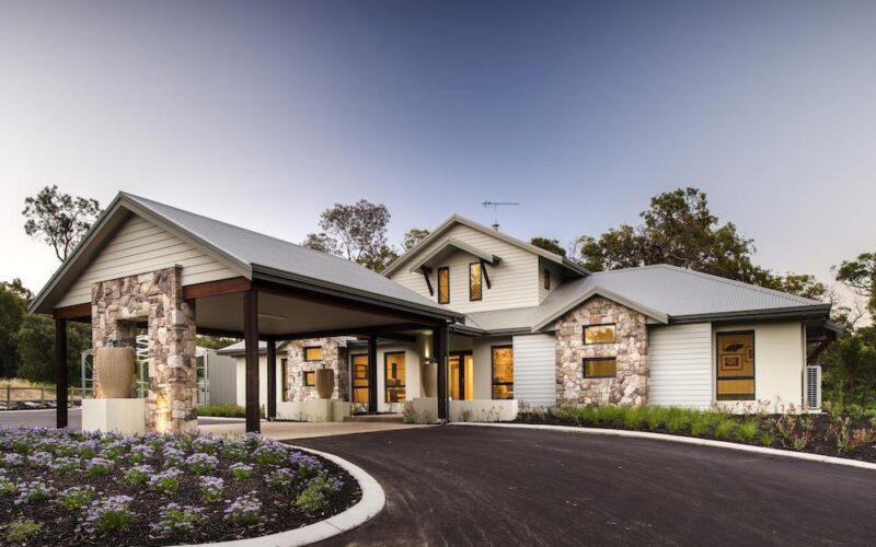 Country home with a big driveway and car port