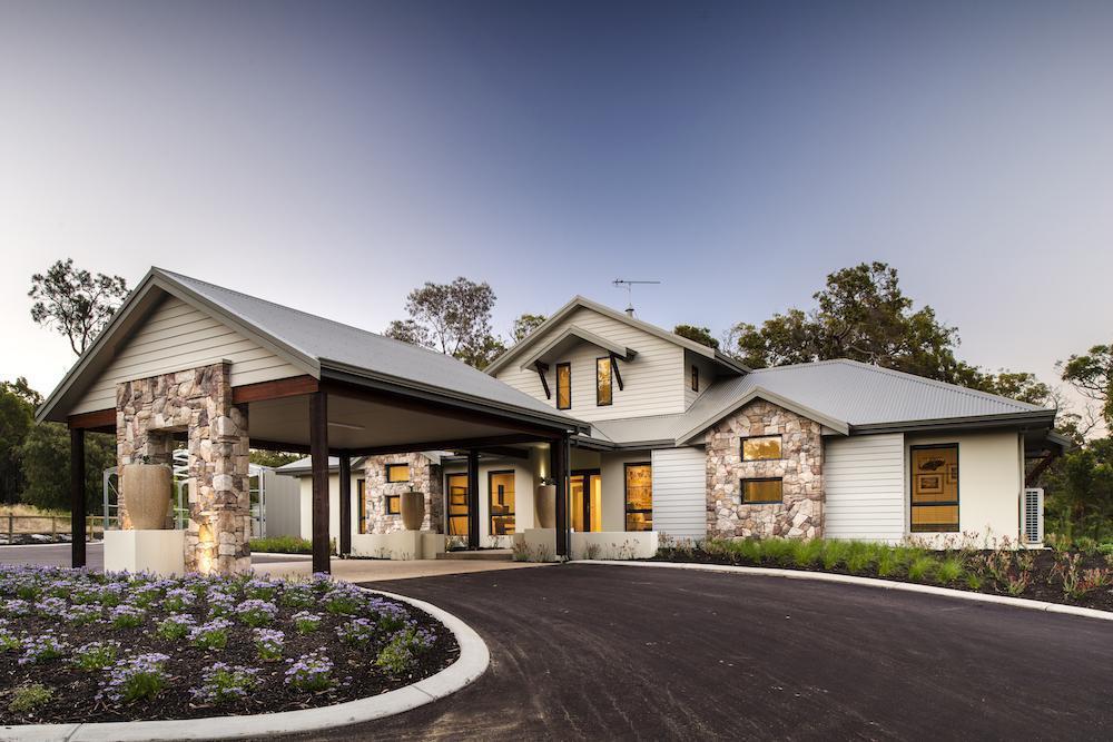 Country home with a big driveway and car port