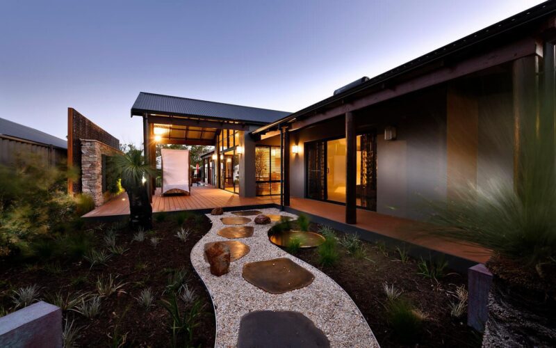 outdoor view of a rural building company home at sunset