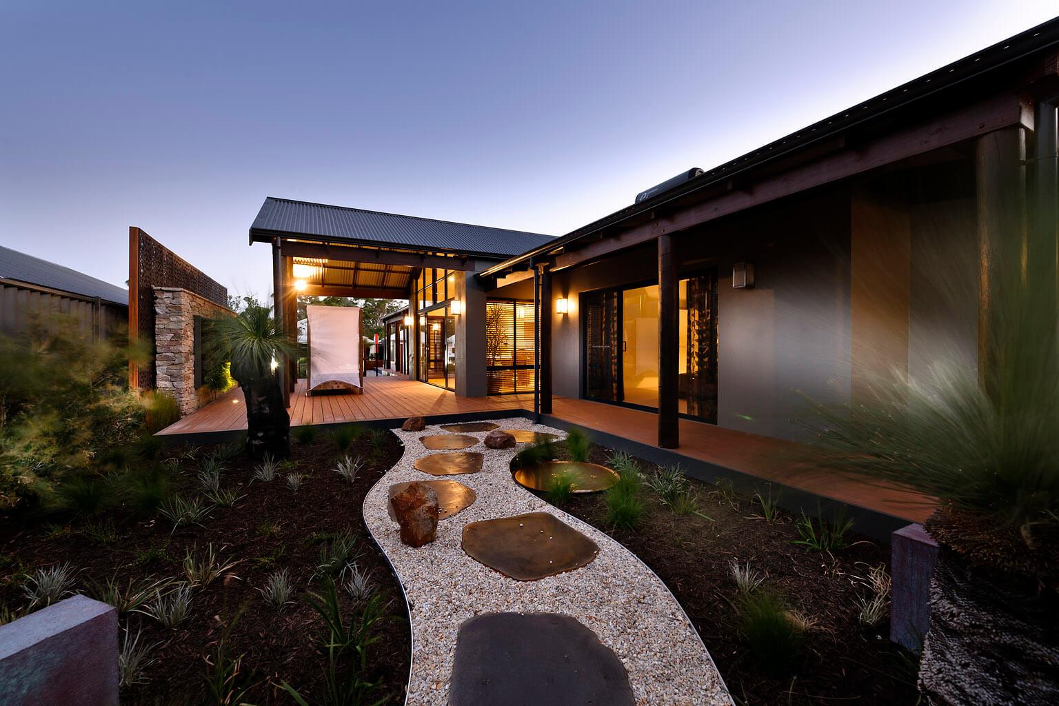 outdoor view of a rural building company home at sunset
