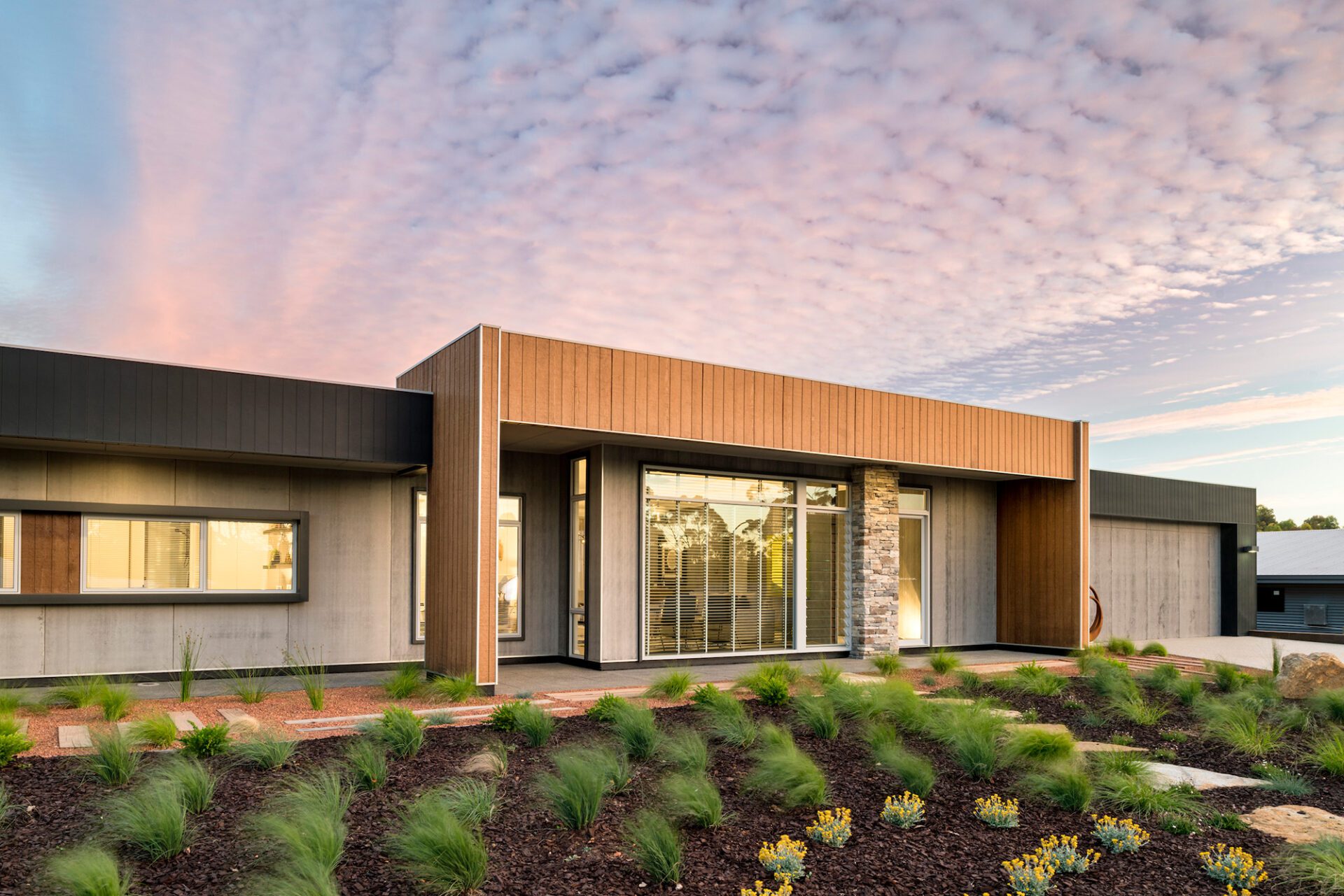 Sunset over one of rural building company's home designs