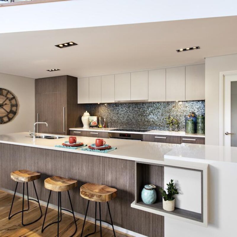 Kitchen with mosaic tile splashback, timber island bench and bar stools