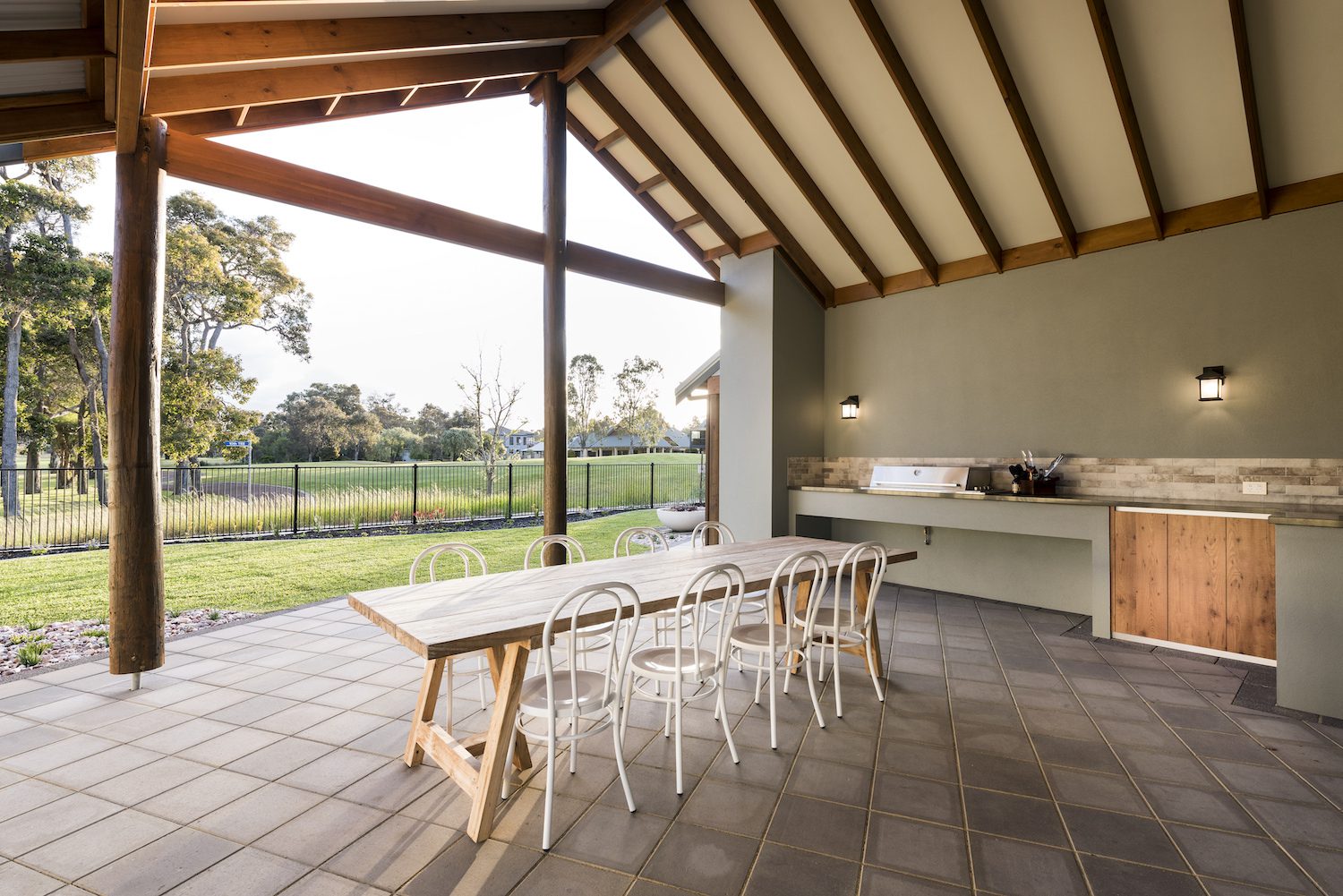 Covered alfresco area with wooden beams and country outlook
