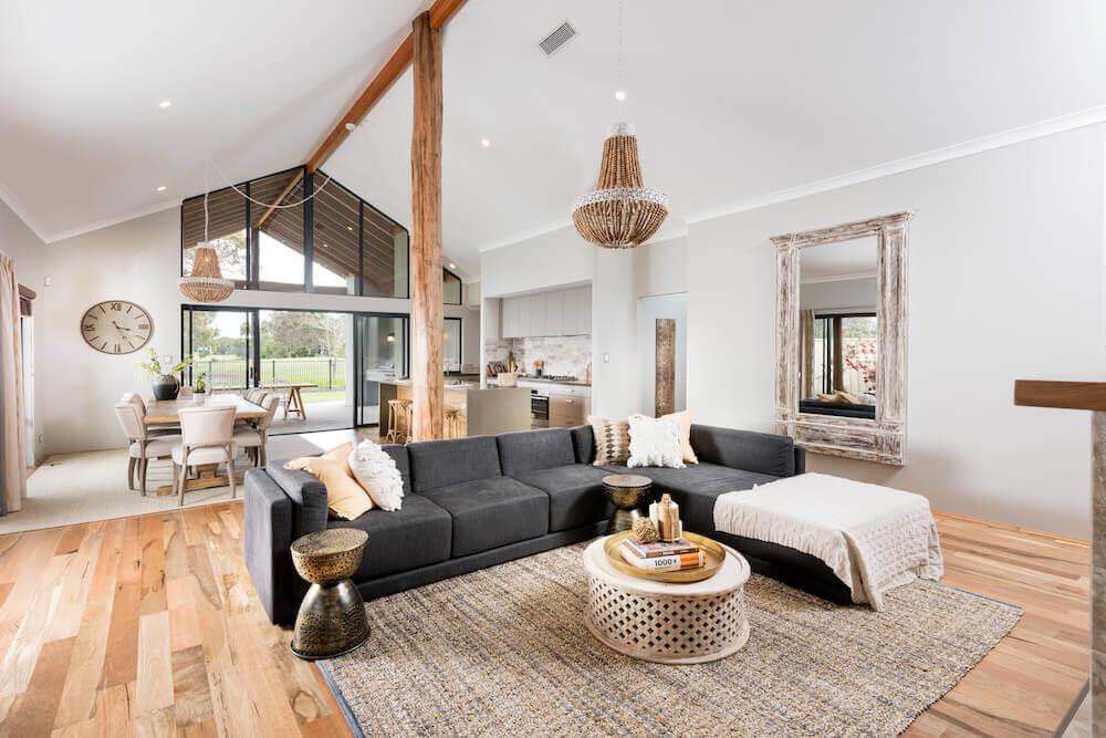 bright, light, living room with raked ceilings and wooden beams