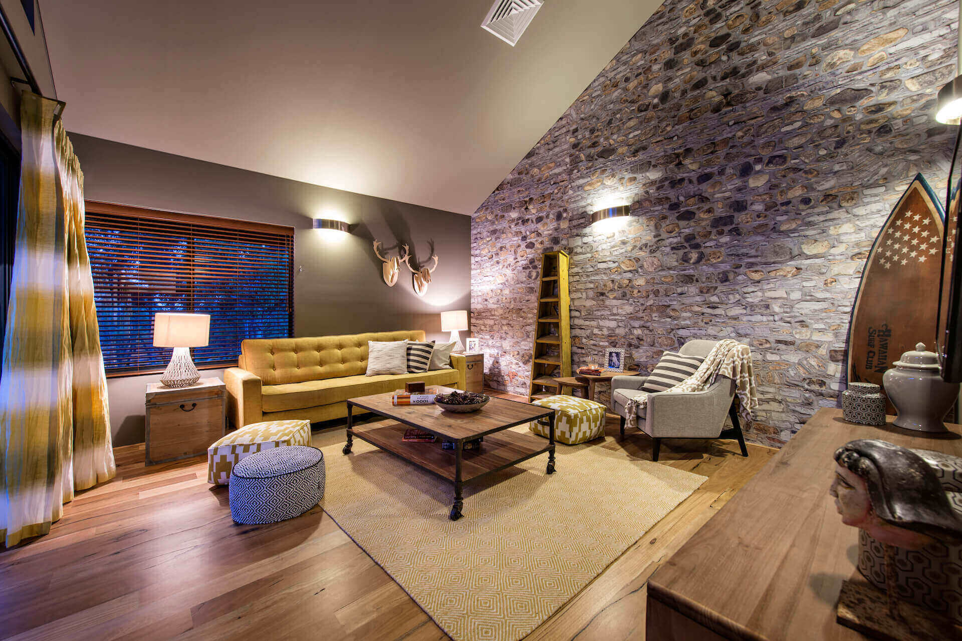 dark earthy living room with a yellow couch