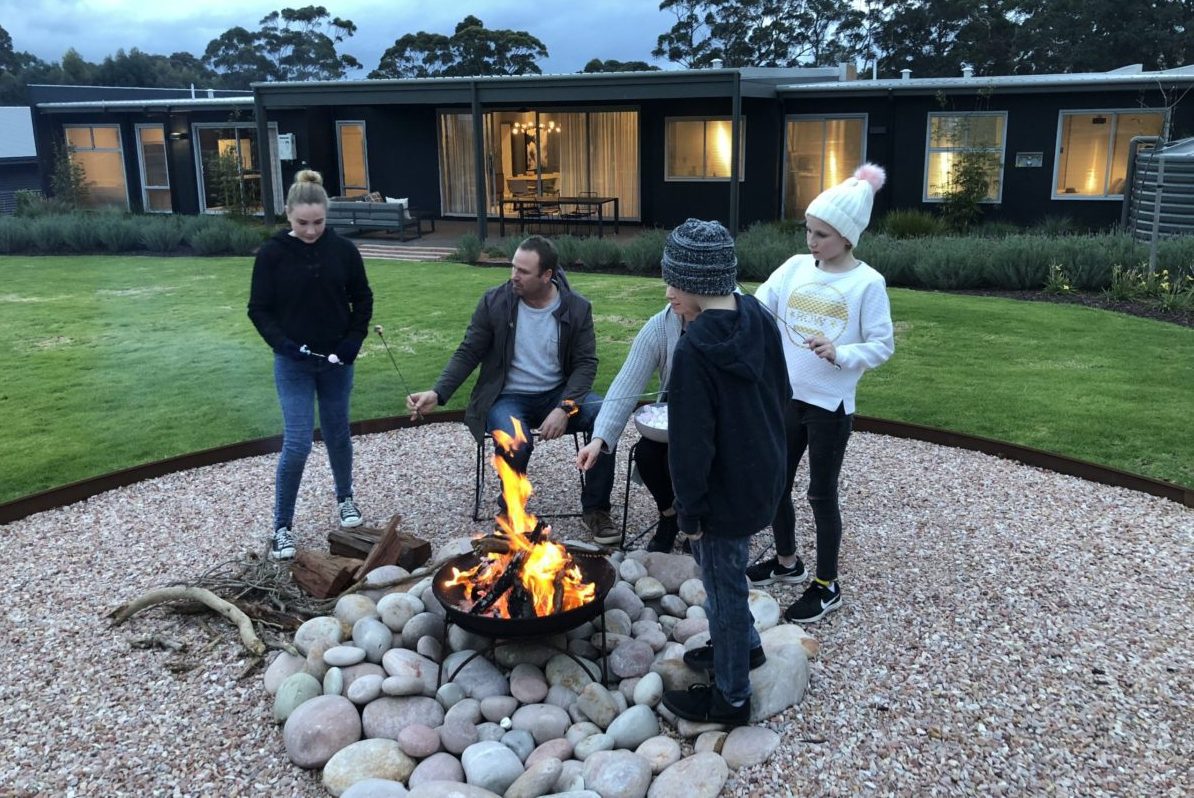 friends gathered around a firepit