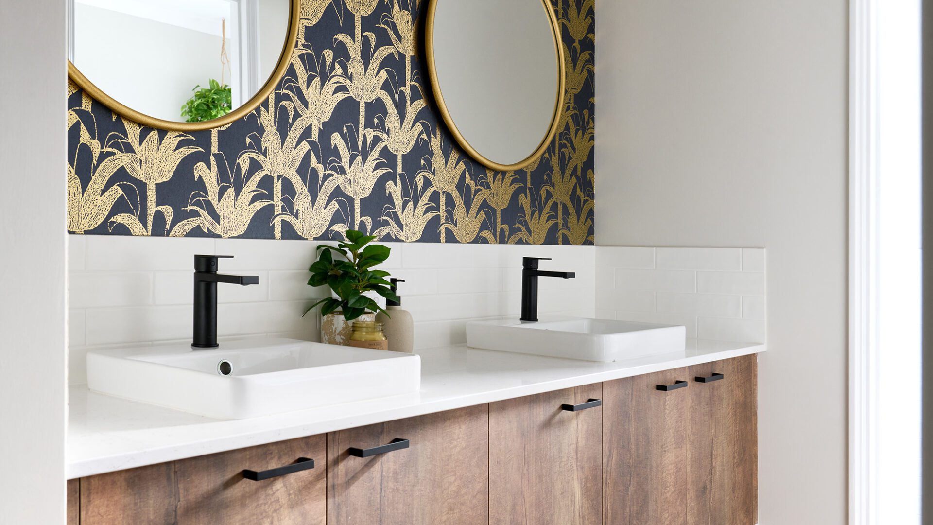 bathroom with feature wallpaper and double vanity