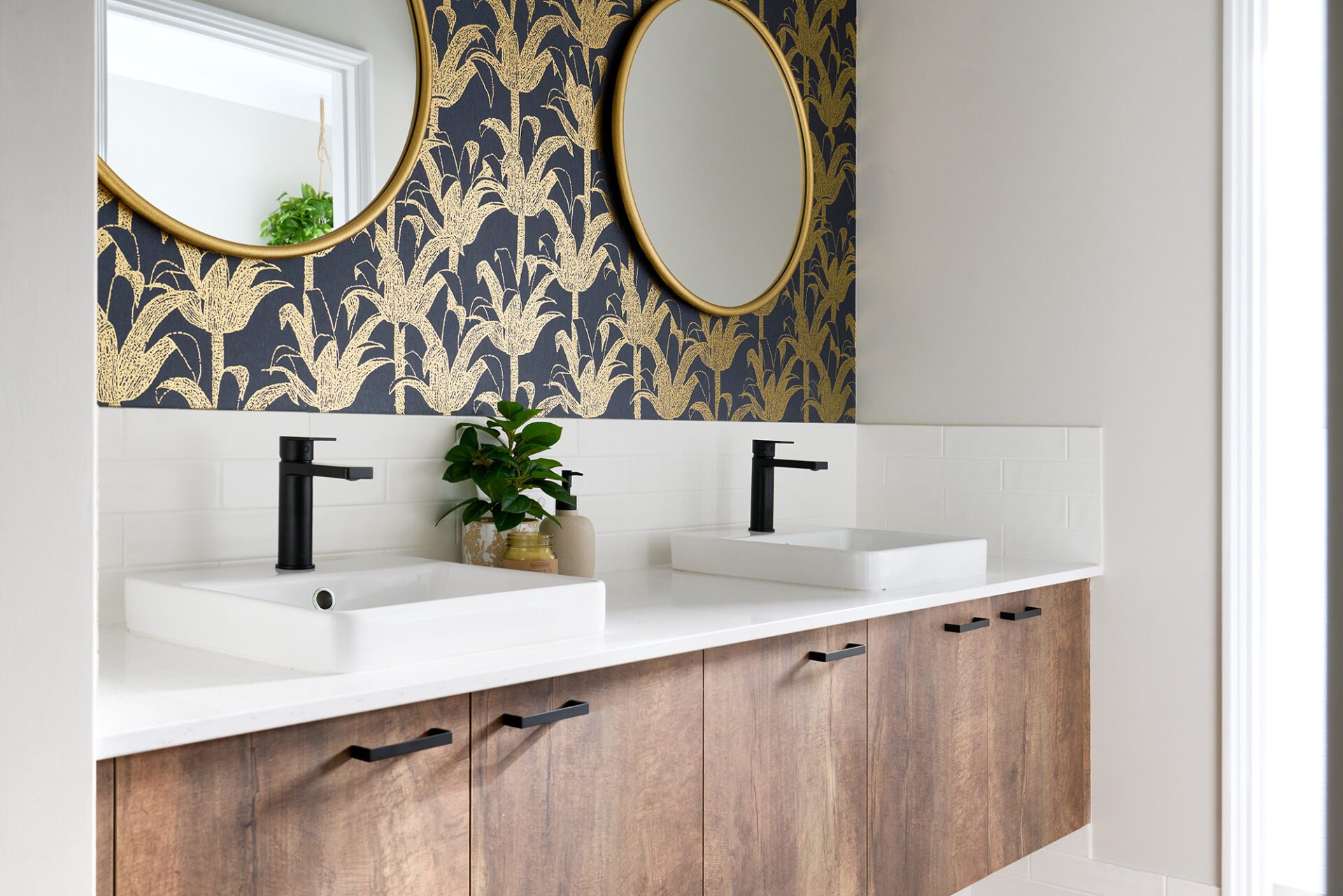 bathroom with feature wallpaper and double vanity