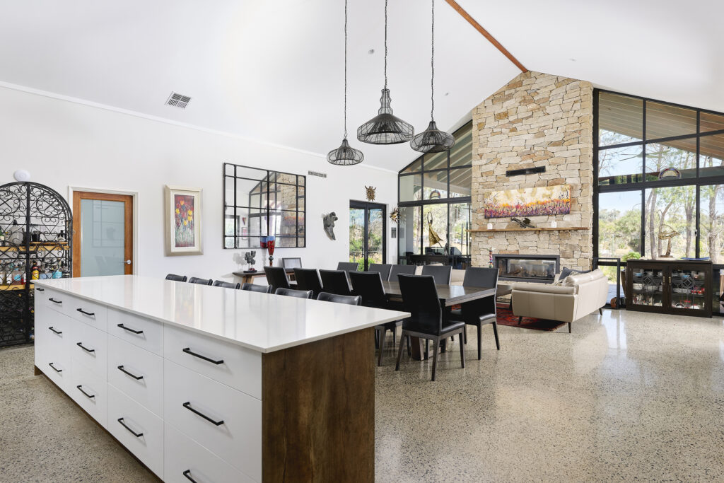 A custom Rural Building Co. home in Gidgegannup featuring high ceilings with a feature fireplace.