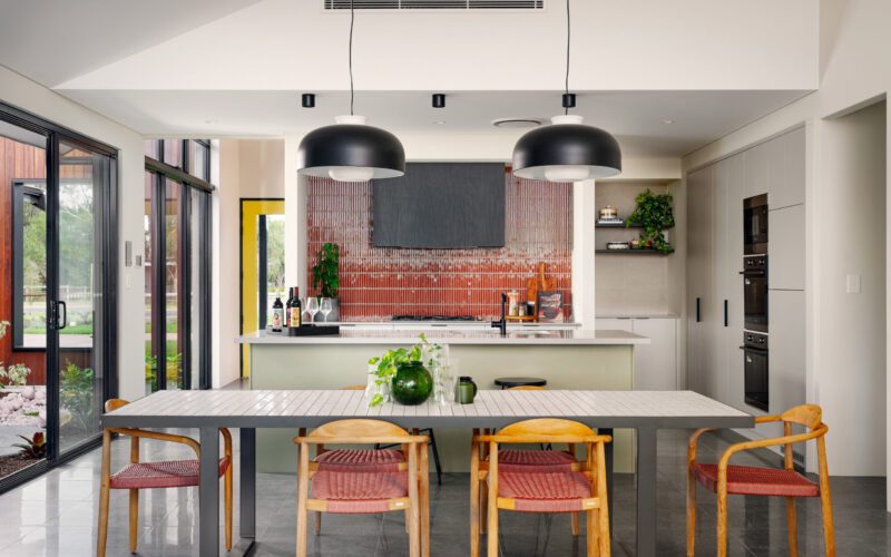 sage green kitchen cabinets and coloured splashback
