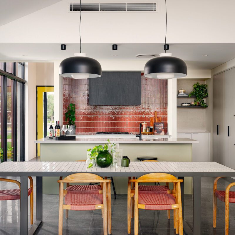 sage green kitchen cabinets and coloured splashback