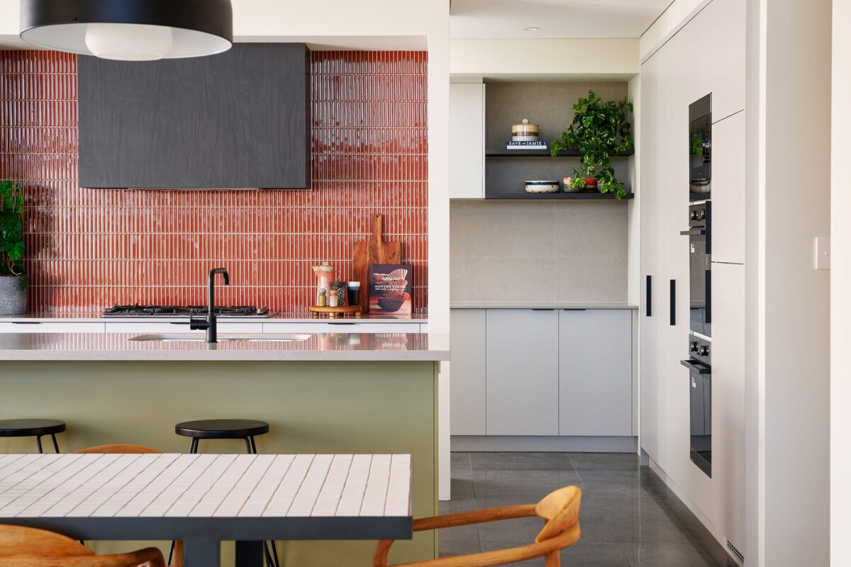 sage green kitchen and coloured splashback