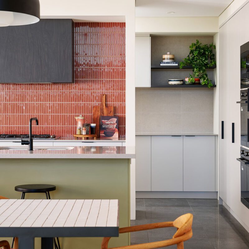 sage green kitchen and coloured splashback