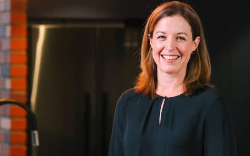 Portrait of a JWH Group team member in a display home kitchen