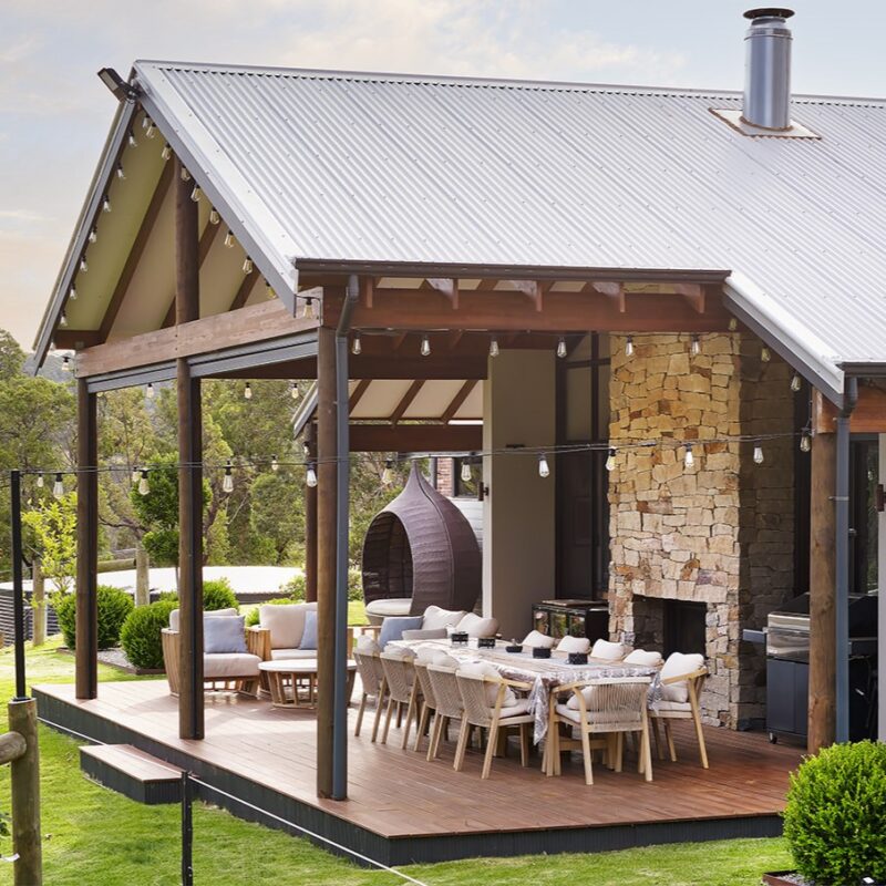 A two-way fireplace, facing both inside and out, adds to the appeal.