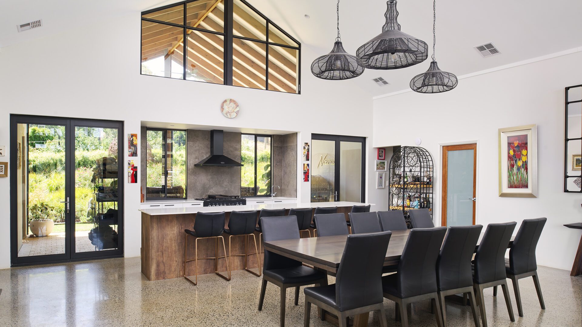 High ceilings and large windows in the living space in Rural Building Co