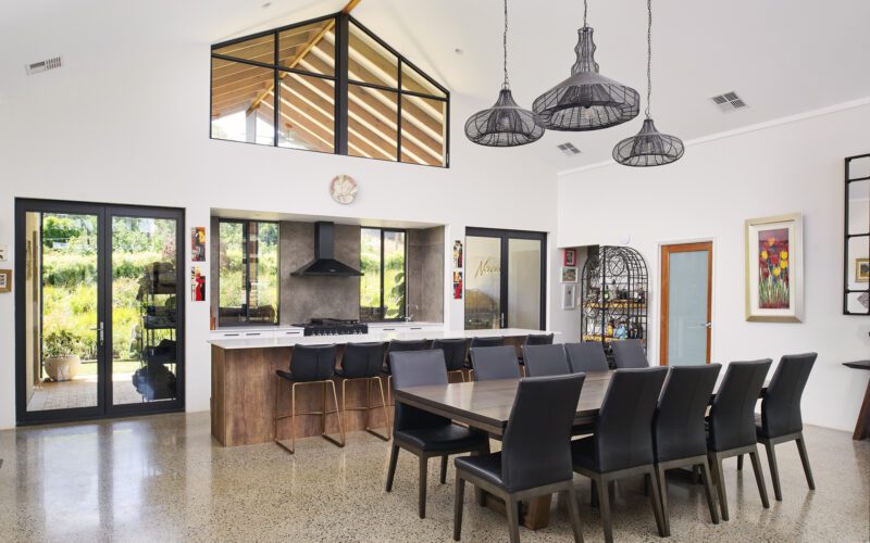 High ceilings and large windows in the living space in Rural Building Co