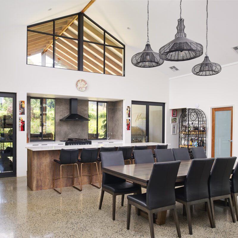 High ceilings and large windows in the living space in Rural Building Co