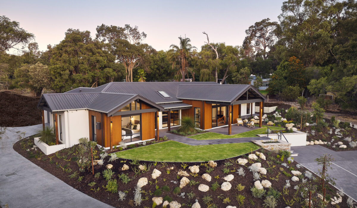 Rural Building Company rural home design in WA, aerial view of a single storey home with mulched garden beds and bushland