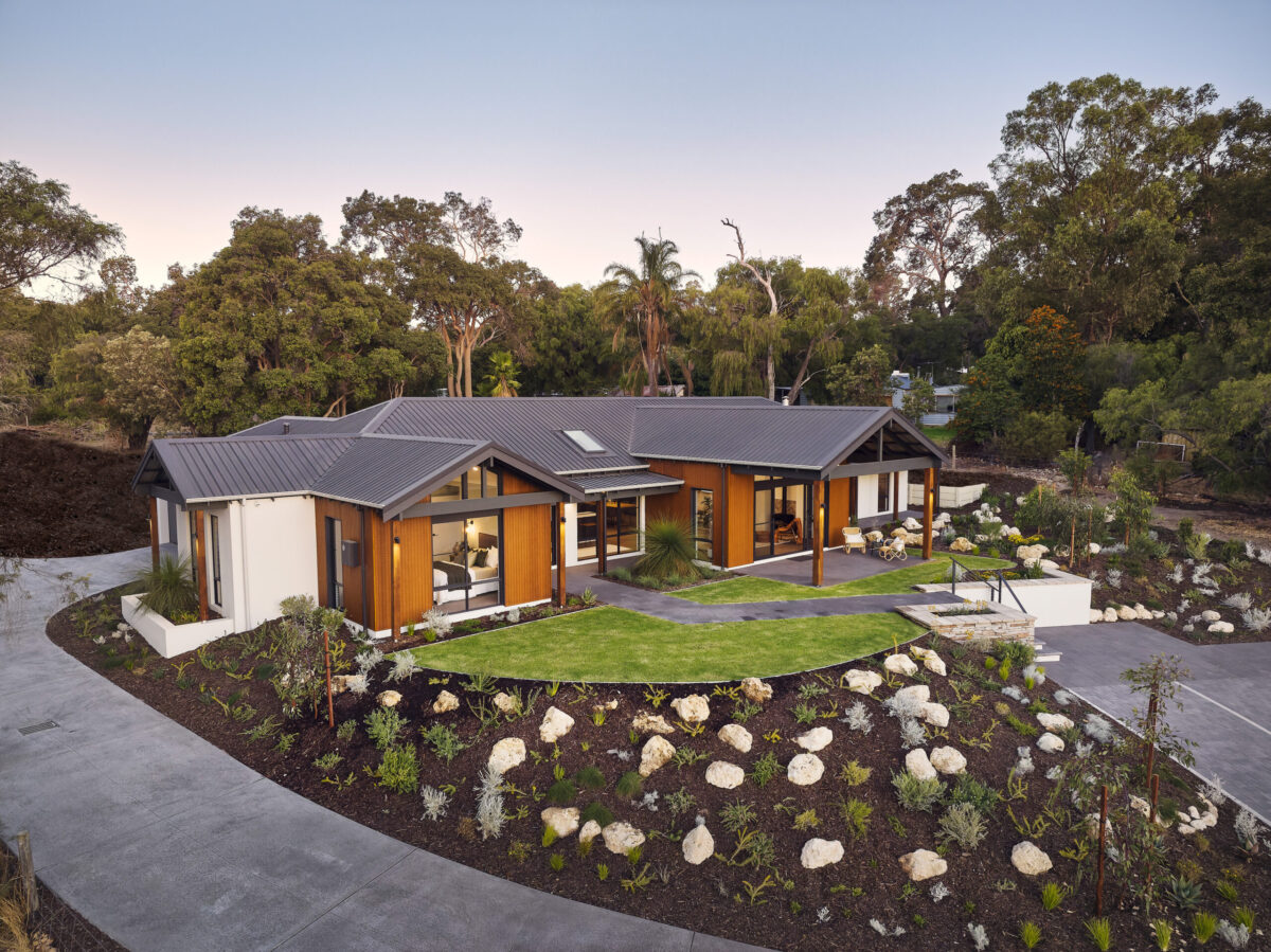 Rural Building Company rural home design in WA, aerial view of a single storey home with mulched garden beds and bushland