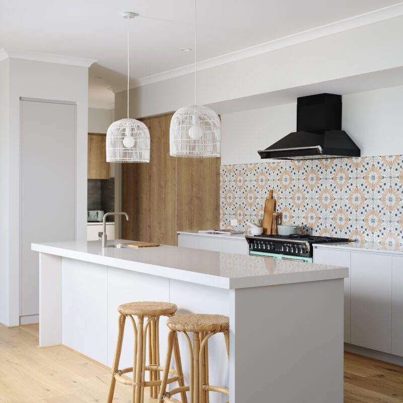 Natural light from tall windows floods into the kitchen in The Darlington display home - Rural Building Co.