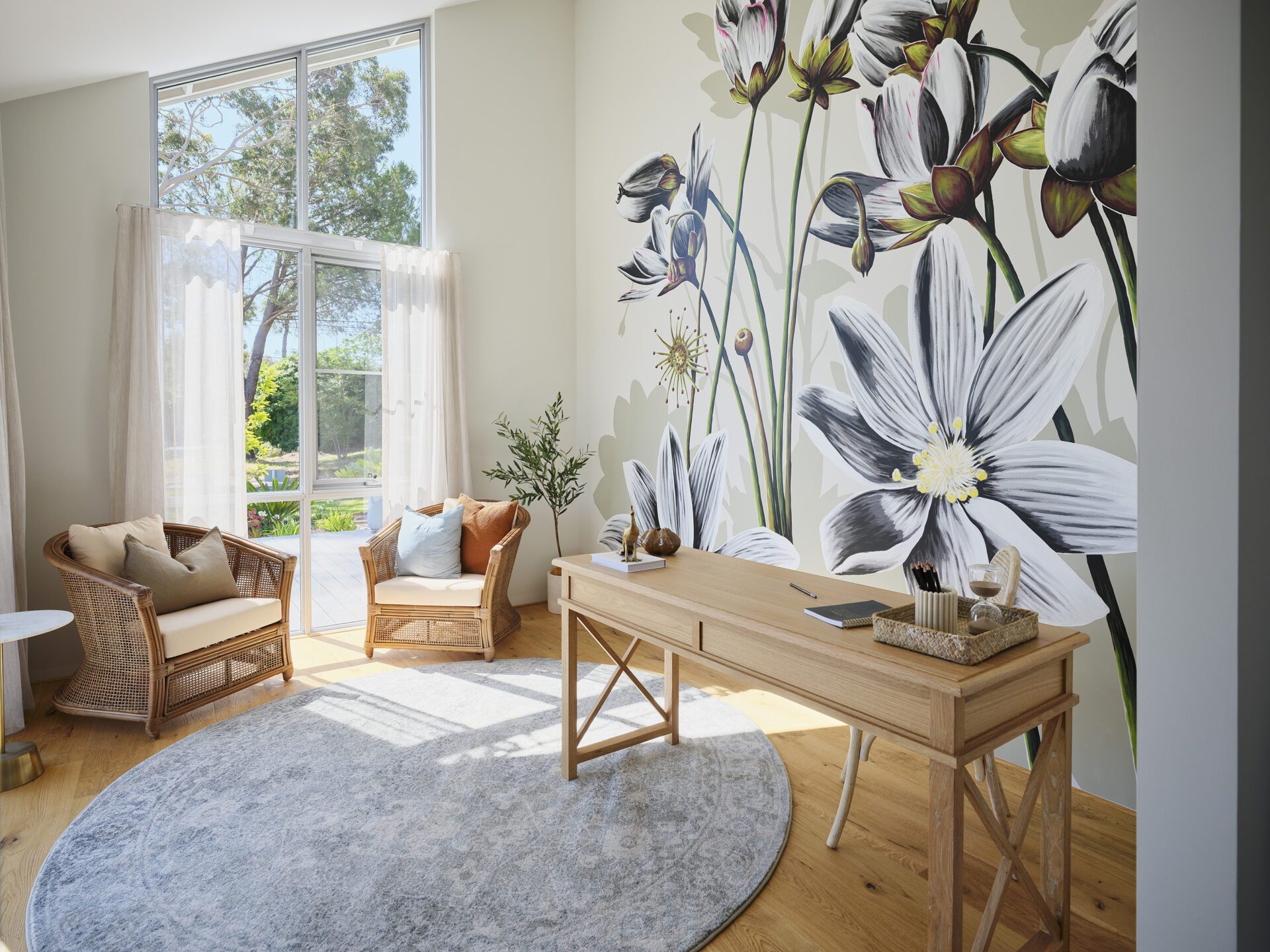 Local artist painting depicting the swamp rainbow native plant 'Drosera Heterophylla' on the feature wall in 'the den' - Rural Building Co.