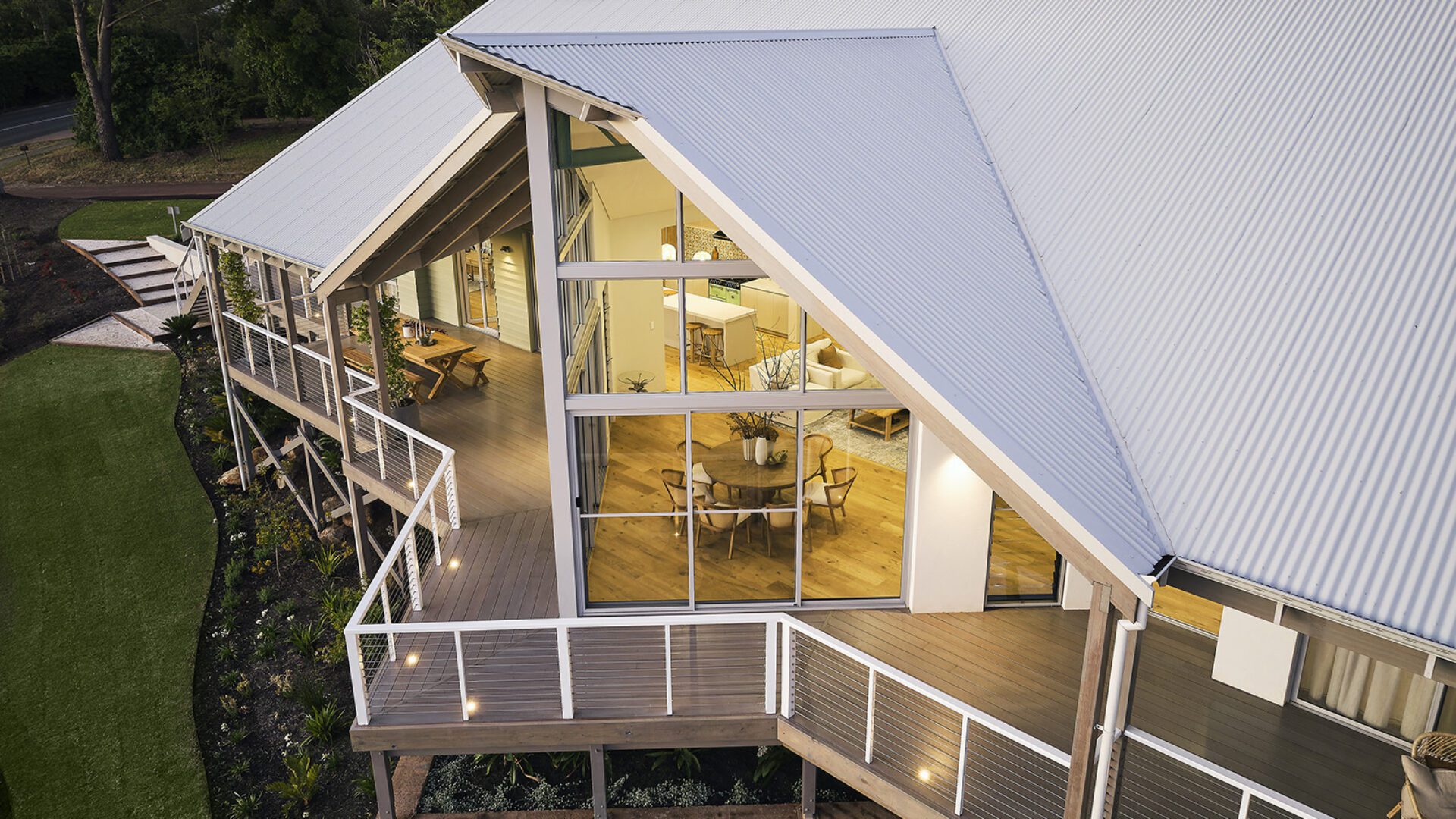An iconic take of the modern Australian farmhouse with a feature floor to ceiling window - Rural Building Co.