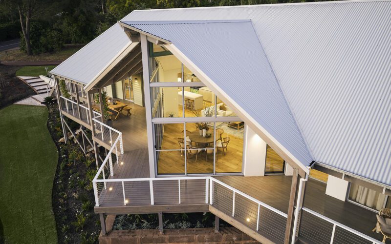 An iconic take of the modern Australian farmhouse with a feature floor to ceiling window - Rural Building Co.