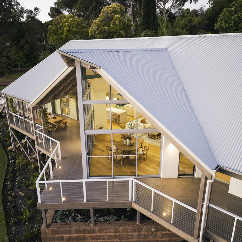 An iconic take of the modern Australian farmhouse with a feature floor to ceiling window - Rural Building Co.