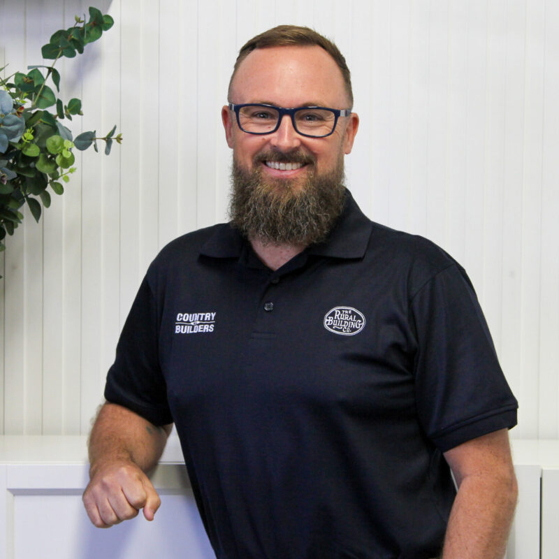 Portrait of Brook from Country Builders in a branded polo shirt