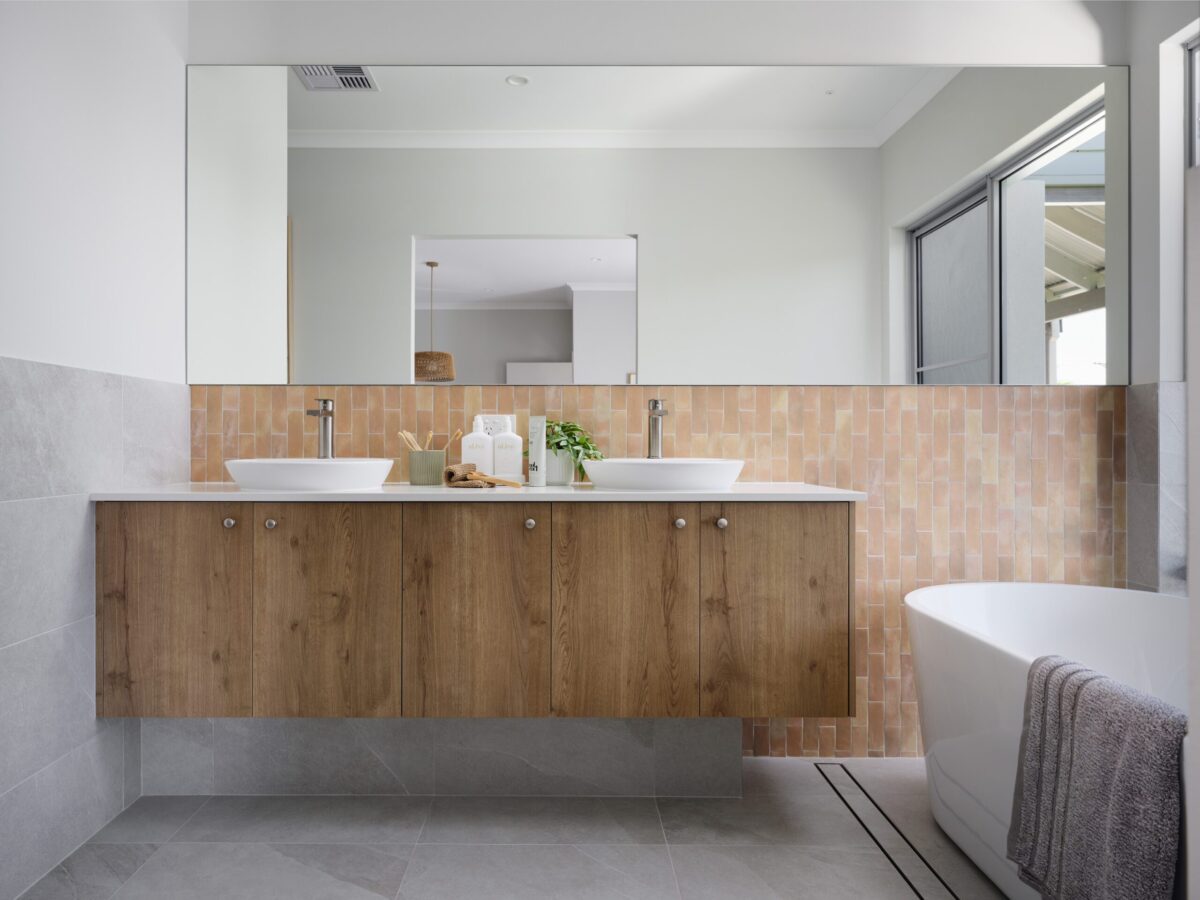 Bathroom with twin basins, timber vanity and freestanding bath