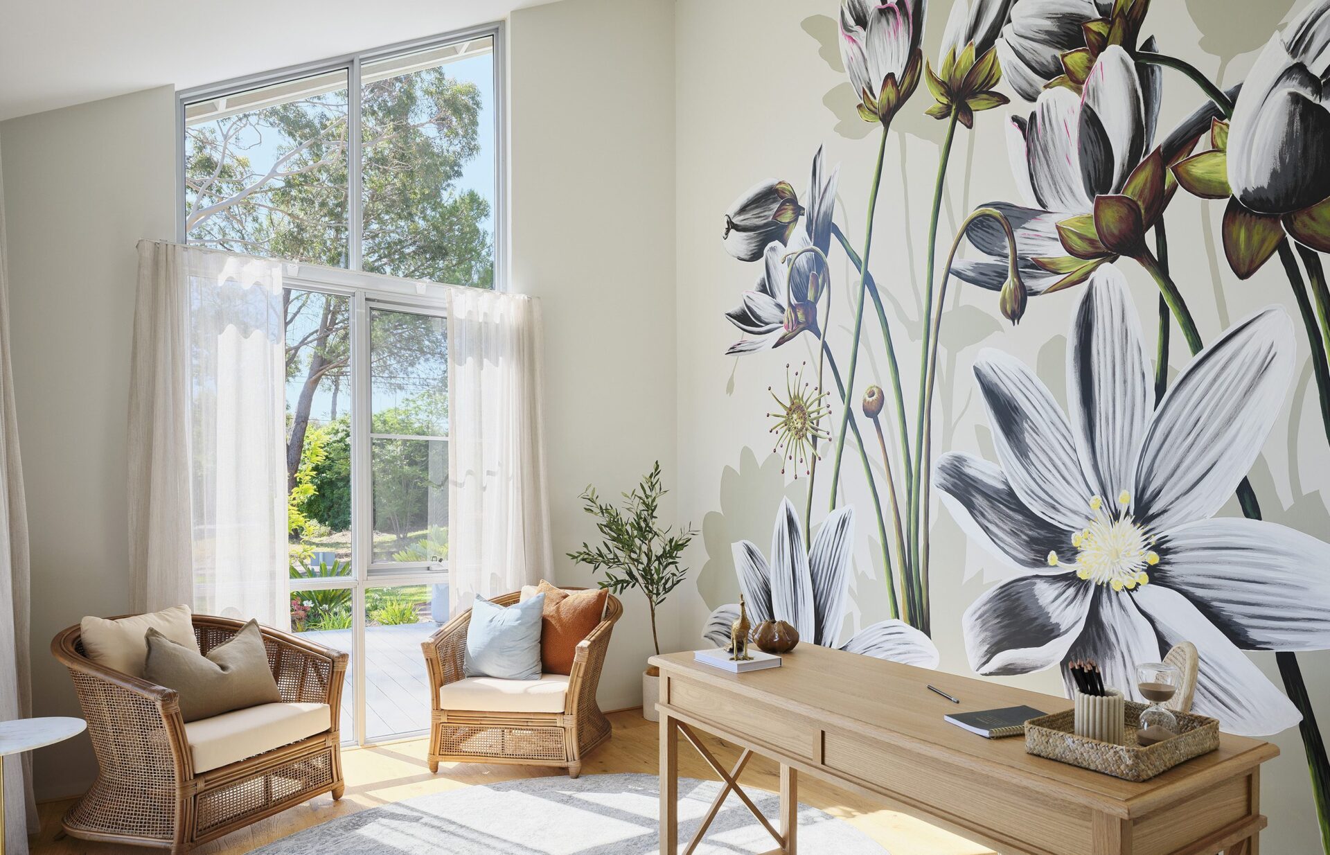 Local artist painting depicting the swamp rainbow native plant 'Drosera Heterophylla' on the feature wall in 'the den' - Rural Building Co.